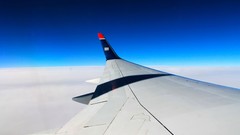 Clouds Aircraft wings skies skyline blue skies aircraft wing