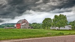 Clouds barn Wisconsin houses fields farms
