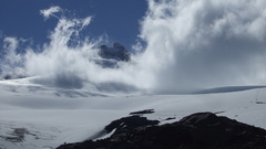 Clouds snow blue sky