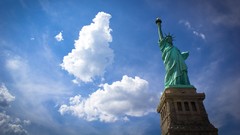 Clouds statues Statue of Liberty USA skyscapes