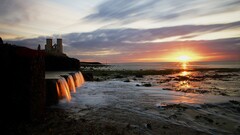 coast castle sunlight waterfall