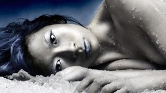 Cold woman asians black hair laying on side