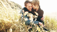 Couple fields smiling