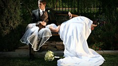 Couple groom brides park bench