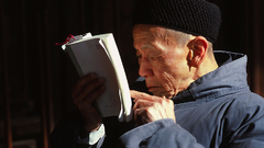 Daoist man reading high