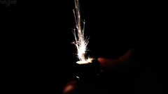 Dark light lighter sparks black background