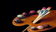 Design food chocolate black background Candies powder paint 