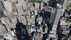 Empire State Building shadows new york city rooftops