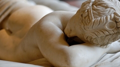 Faces sculptures lying down