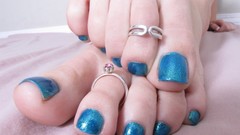Feet woman close-up nail polish toe rings toes