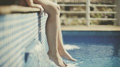Feet woman legs swimming pools