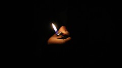 Fire dark hands black background lighters