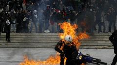 Fire riots crowd motorbikes