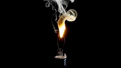 Fire smoke black background artistic light bulbs
