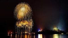 Fireworks reflections nighttime water body nightlights