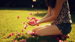 Flowers grass Green woman hands flower petals denim shorts