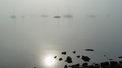 Fog water Boats rocks reflections