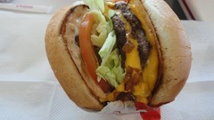 Food cheese bread meat restaurant tomatoes salad bacon napkins 