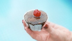 Food hands cherries cakes blurred background Simple Background