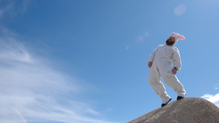 Funny bunnyman on rock