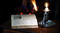 Furniture Books Candles flames writing blurred background