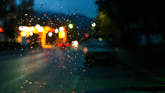 Glass lights cars water drops rain on glass