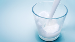 Glass milk blue background