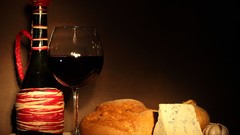 Glass red wine food cheese bread garlic