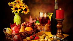 Glass wine Candles nuts strawberries red wine