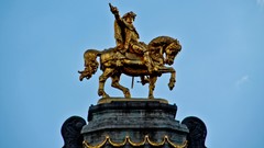 Gold Horses rider skies blue skies