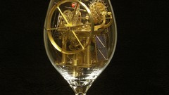 Gold mechanism wheel gears wine glass artwork