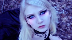Gothic woman cross blondes blue eyes