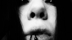 Gothic woman monochrome piercings pierced lips