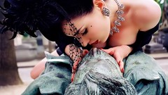 Gothic woman statues kissing