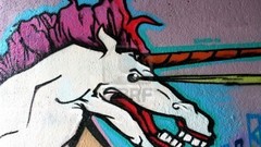 Graffiti abstract unicorns brick wall street art