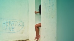 Graffiti interior sitting legs hidden