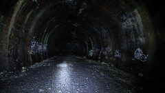 graffiti tunnel dark spooky gravel