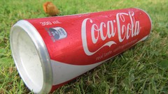 Grass coca-cola soda cans