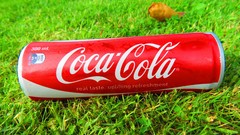 Grass coca-cola soda cans
