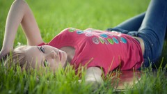 Grass eyes pink woman jeans lips faces shirts blondes lying 