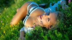 Grass sun woman blondes lingerie lying down boobs
