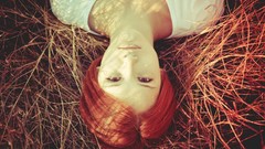 Grass woman lying down redheads