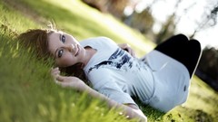 Grass woman outdoors blue eyes brunettes models lying down