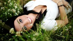 Grass woman teeth smiling blue eyes brunettes
