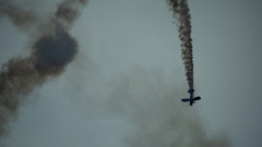 Gray Aircraft smoke falling