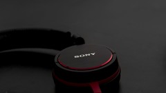 Gray black red headphones Nikon Sony still life