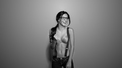 Gray woman glasses monochrome suspenders smiling long hair 
