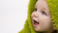 Green baby happy smiling blue eyes