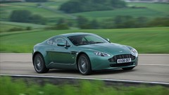 Green cars Aston Martin roads