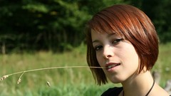 Green woman faces redheads